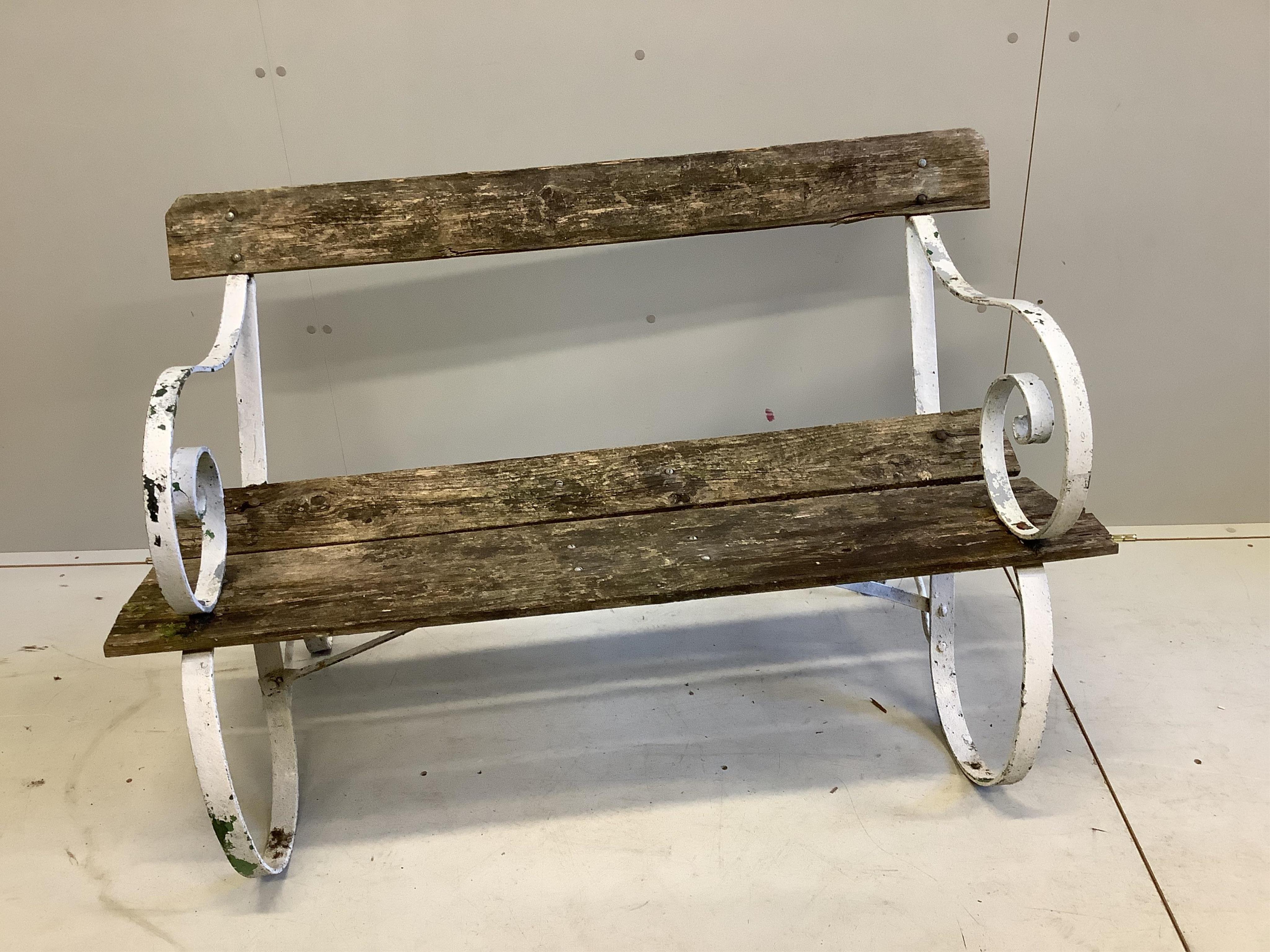 A wrought iron and planked garden bench, width 120cm. Condition - weathered